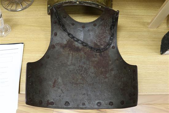 A pair of Victorian brass and iron armour chest plates